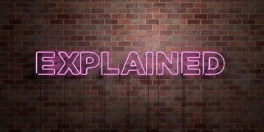 'GAP Terms Explained' pink neon sign on brick wall