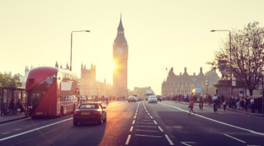 A London road with Big Ben and the sunset in the background