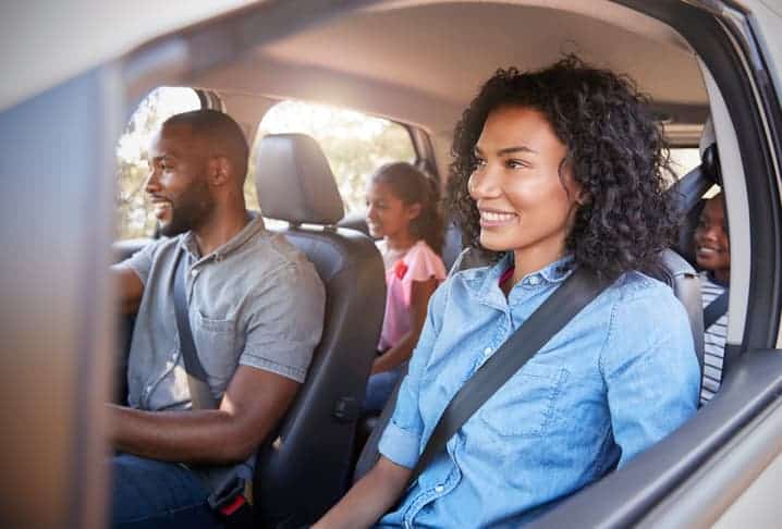 young family in car