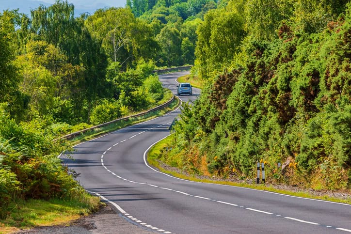 car on a road with curves in Scotland