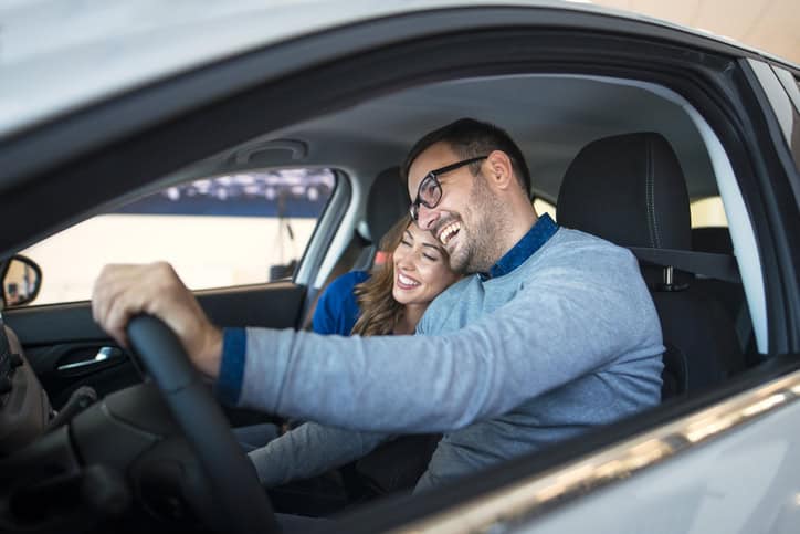 happy couple together in a car